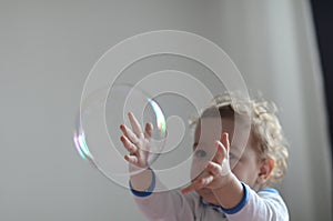 Girl playing with soap bubbles