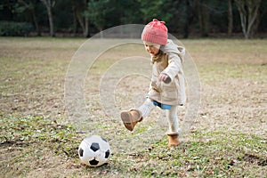 Girl playing with a soccer ball