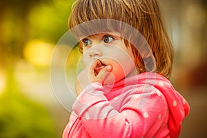 Girl playing in the street. sunlight