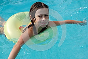 Girl playing in swimming pool