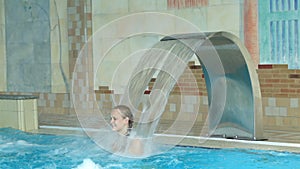 Girl playing in a swimming pool
