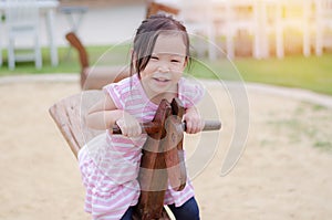 Girl playing totter at playground