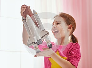 Girl playing with toy rocket