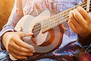 Girl playing ukulele