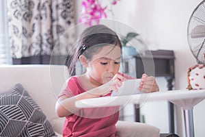 Girl playing video games on cellphone