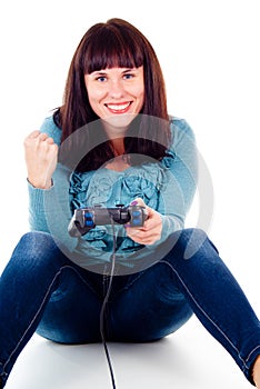 A girl playing video games, rejoicing the victory