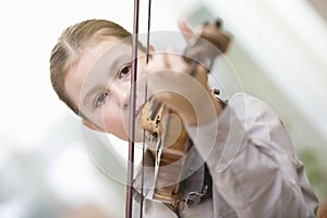 Girl Playing Violin At Home