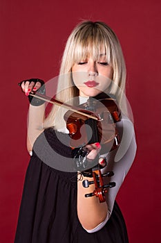 Girl playing the violin portrait