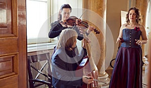 girl playing violin, string ensemble rehearsal photo