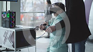 girl playing with virtual reality glasses