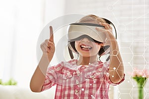 Girl playing in virtual reality glasses