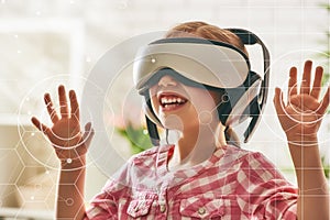 Girl playing in virtual reality glasses