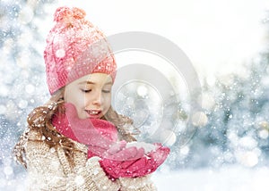 Girl playing on a winter walk