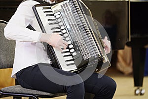 Girl plays the accordion