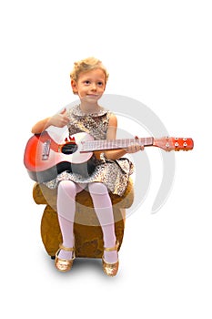 Girl plays the guitar, a smile on her face