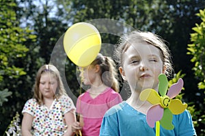 Girl plays with windmill