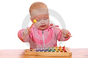 Girl plays xylophone