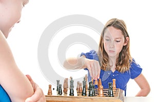 Girl plotting next move in chess