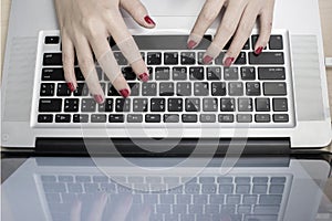 Girl point finger on keyboard