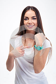 Girl pointing finger at her watch