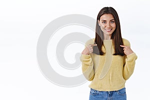 Girl pointing at herself and smiling as suggest own help, personal candidature, express willingness to participate in