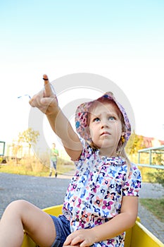 Girl points with a finger