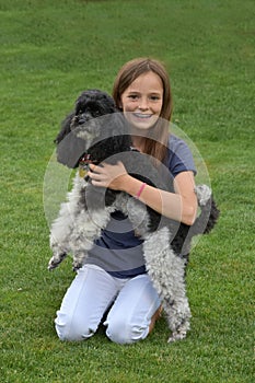 Girl and poodle dog