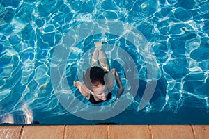 Girl Pool Underwater Surfacing