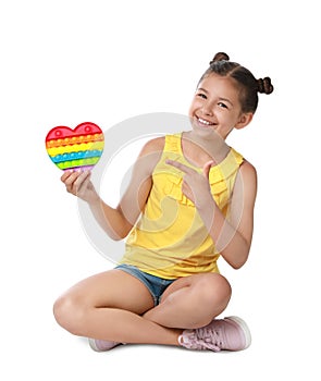 Girl with pop it fidget toy on white background photo