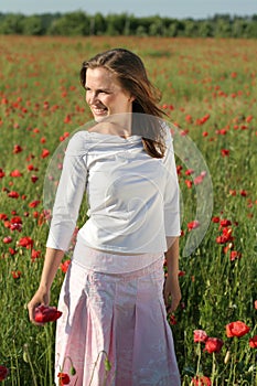 Girl in poppy field