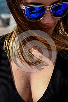 Girl portrait with blue unbranded sunglasses