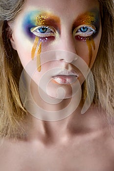 Girl portrait with creative colorful rainbow makeup