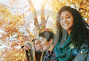 Girl, portrait and friends outdoor in park for relaxing day on summer vacation of semester break, together and happiness photo