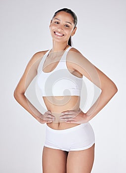 Girl, portrait and underwear in studio for confidence, wellness and self care for body on white background. Happy female