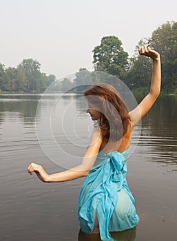 Girl posing against river