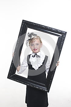 Girl posing in antique frame