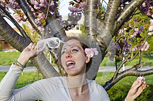 Girl posing with big party sunglasses outdoors