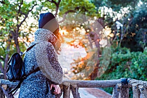 Girl posing and enjoying the beautiful colorful sunset - close up