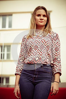 Girl posing in fashionable clothes