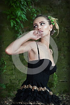 Girl posing in front of wall