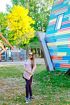 Girl posing at the inverted house