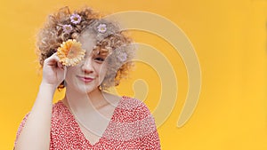 Girl Posing With An Orange Gerbera Daisy Flower Covering Her Eye With Daisy
