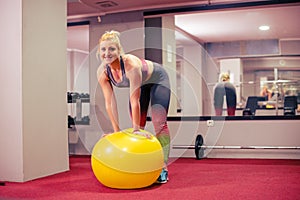 Girl posing with pilates ball