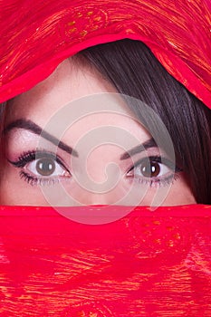 girl is posing in red yashmak