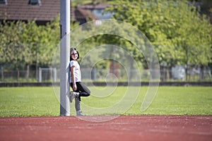 Girl posing a on a sports facility