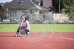 Girl posing a on a sports facility