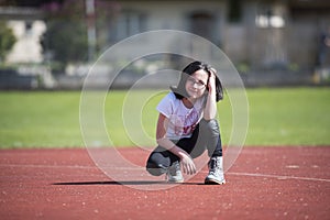 Girl posing a on a sports facility