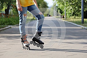 Girl posing while standing on rollers.