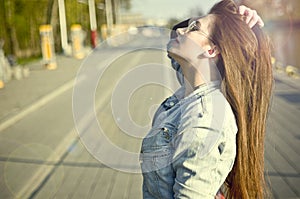 Girl posing in sunlight