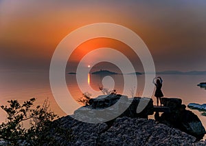 A Girl Posing for the Sunset photo